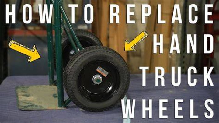 How do you change a tire on a hand truck?