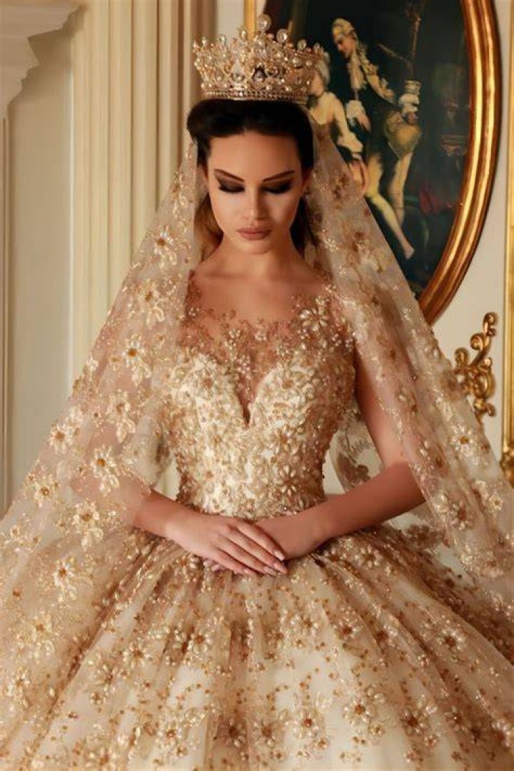What does a gold wedding dress mean?