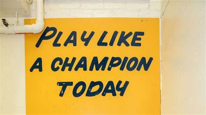 What is the Play Like A Champion Today sign made of?